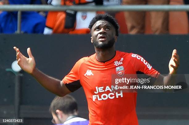 Lorient's Nigerian forward Terem Moffi reacts after scoring during the French L1 football match between FC Lorient and Stade de Reims, at Stade du...