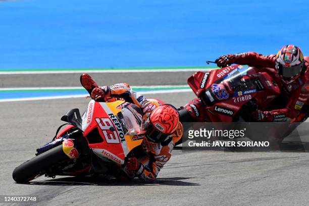 Honda Spanish rider Marc Marquez looses control of his bike as he competes in the MotoGP Spanish Grand Prix at the Jerez racetrack in Jerez de la...