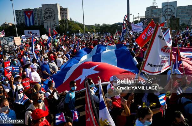 People march during the commemoration of May Day to mark the international day of the workers, at Havana's Revolution Square, on May 1, 2022.