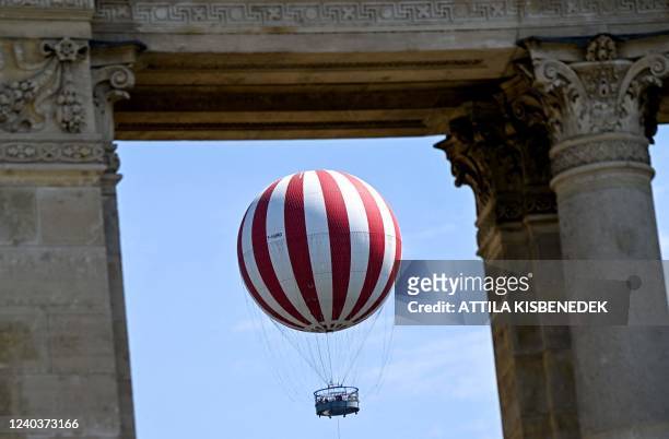 Balloon with 6000 cubic meters of helium, the Hungarian capital's latest tourist attraction, is seen in the air between columns near Heroes' Square...