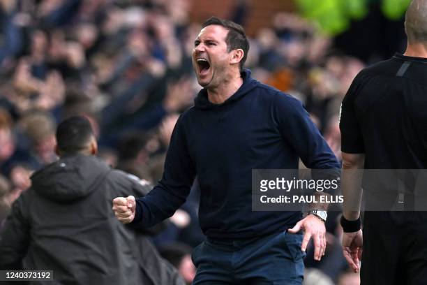 Everton's English manager Frank Lampard celebrates as Everton take the lead in the English Premier League football match between Everton and Chelsea...