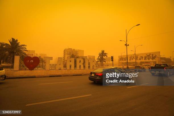 Vehicles move amid yellow dust during the sandstorm in Baghdad, Iraq on May 01, 2022. Visibility degraded in traffic due to the sandstorm.