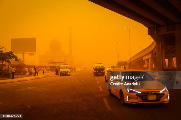 Vehicles move amid yellow dust during the sandstorm in Baghdad, Iraq on May 01, 2022. Visibility degraded in traffic due to the sandstorm.