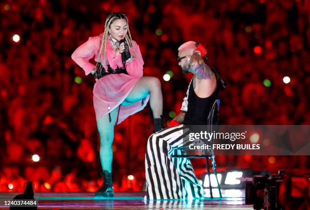 Colombian singer Maluma performs on stage along with pop icon Madonna during his concert "Medallo in the Map", in Medellin, Colombia, on April 30,...