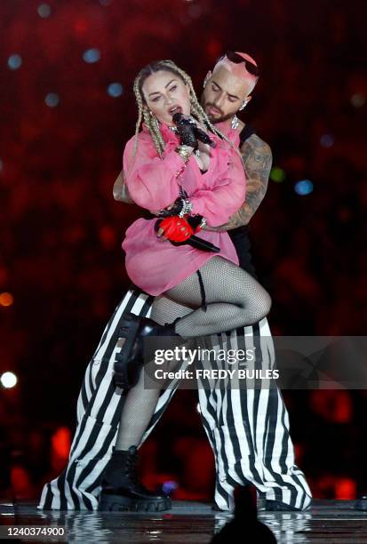 Colombian singer Maluma performs on stage along with pop icon Madonna during his concert "Medallo in the Map", in Medellin, Colombia, on April 30,...