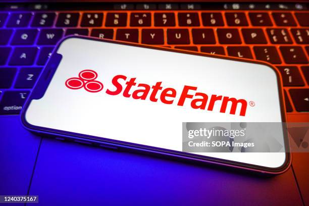 In this photo illustration, a State Farm Insurance Cos logo is displayed on the screen of a smartphone.