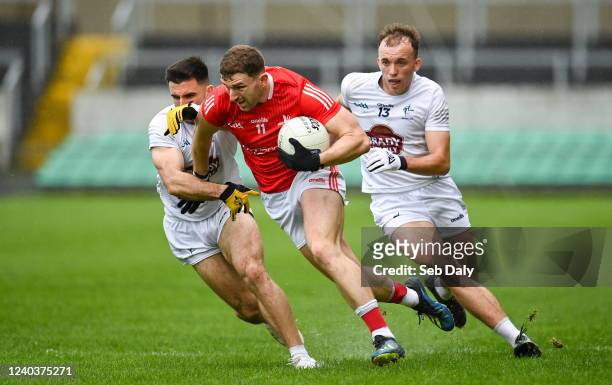 Offaly , Ireland - 1 May 2022; Sam Mulroy of Louth in action against Ryan Houlihan, left, and Brian McLoughlin of Kildare during the Leinster GAA...