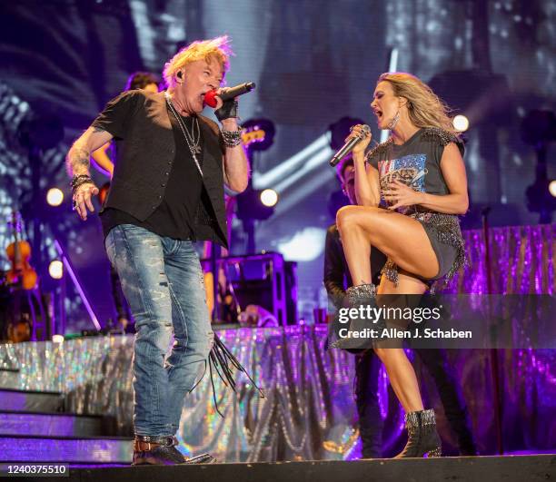 Guns n Roses lead singer Axl Rose makes a surprise appearance with Saturdays headliner Carrie Underwood to sing a pair of the groups famous songs on...