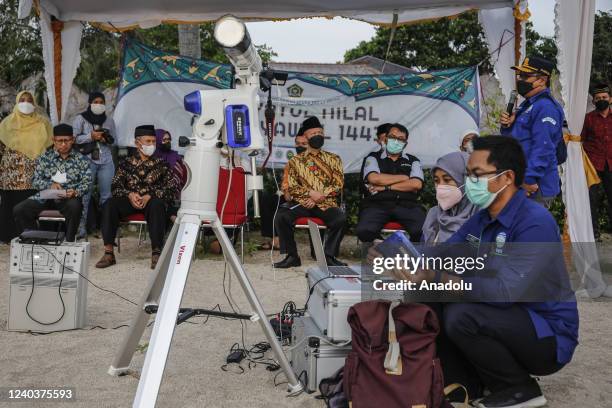 Indonesian Meteorology and Climatology Agency officers prepares a telescope to observe the sighting of new moon to determine the beginning of Shawwal...