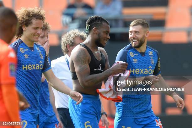 LtoR Reims' Belgian defender Wout Faes, Reims' French defender Andrew Gravillon and Reims' Kosovar forward Arber Zeneli react at the end of the...