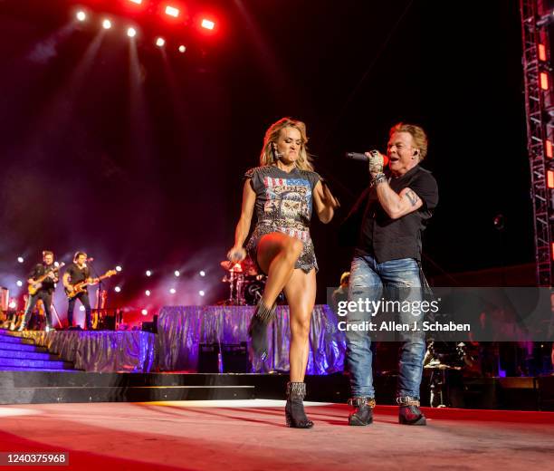 Guns n Roses lead singer Axl Rose makes a surprise appearance with Saturdays headliner Carrie Underwood to sing a pair of the groups famous songs on...