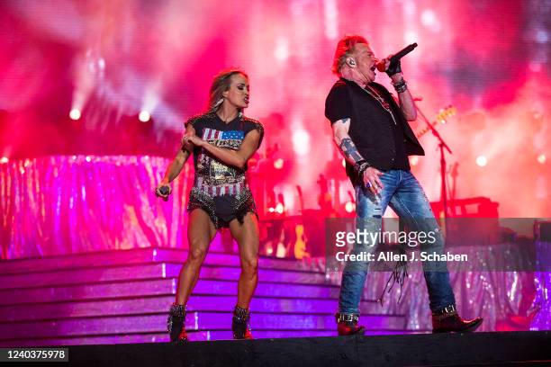 Guns n Roses lead singer Axl Rose makes a surprise appearance with Saturdays headliner Carrie Underwood to sing a pair of the groups famous songs on...