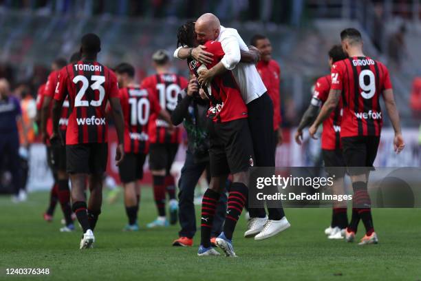 Stefano Pioli of AC Milan and Rafael Leao of AC Milan celebrate after winning the Serie A match between AC Milan and ACF Fiorentina at Stadio...