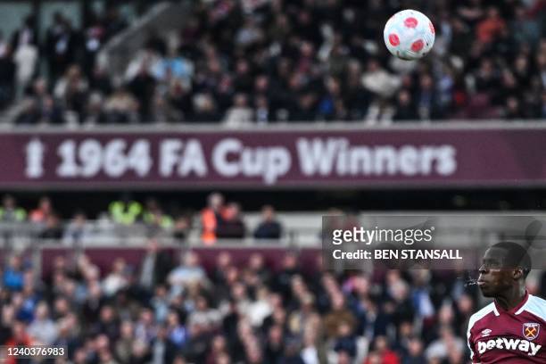 West Ham United's French defender Kurt Zouma heads the ball during the English Premier League football match between West Ham United and Arsenal at...