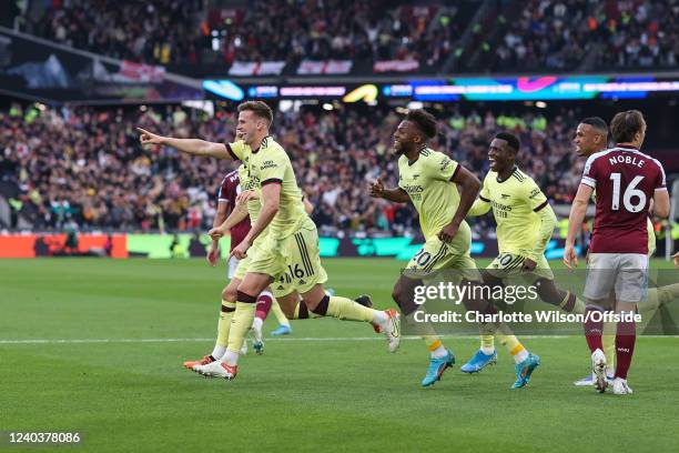 Rob Holding of Arsenal celebrates scoring the opening goal during the Premier League match between West Ham United and Arsenal at London Stadium on...