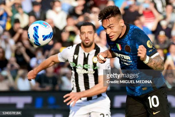 Inter Milan's Argentine forward Lautaro Martinez heads the ball to score his team's second goal during the Serie A football match between Udinese and...