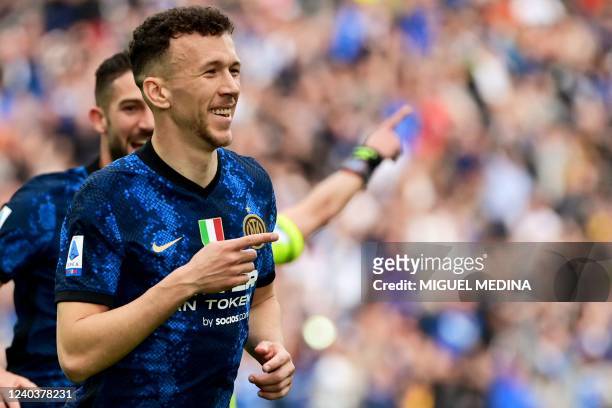 Inter Milan's Croatian midfielder Ivan Perisic celebrates after scoring his team's first goal during the Serie A football match between Udinese and...