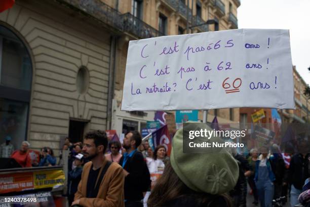 Woman holds a placard reading 'retirement isn't at 65, nor at 62 ! Retirement is at 60yo'. For May Day or Labour Day, thousands of people took to the...