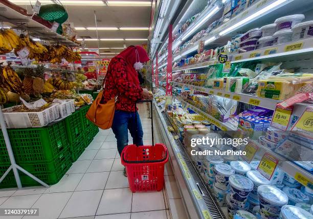 Woman shop at a supermarket in preparations ahead of Eid al-Fitr in Bogor, West Java, Indonesia on May 1, 2022.