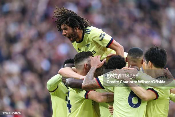 Mohamed Elneny of Arsenal celebrates their first goal during the Premier League match between West Ham United and Arsenal at London Stadium on May 1,...