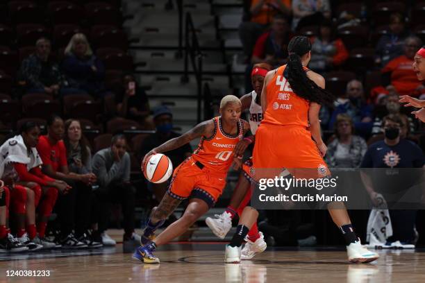 Courtney Williams of the Connecticut Sun dribbles the ball during the preseason game against the Atlanta Dream on May 1, 2022 at the Mohegan Sun...