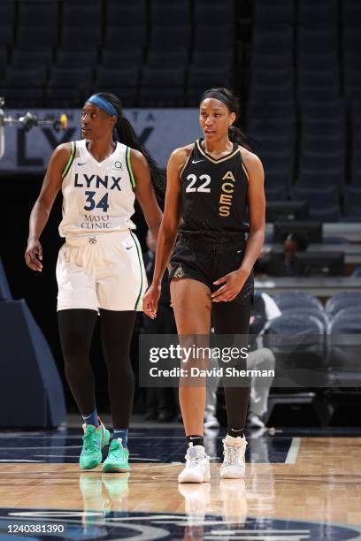 Sylvia Fowles of the Minnesota Lynx and A'ja Wilson of the Las Vegas Aces walks on to the court during the game on May 1, 2022 at Target Center in...