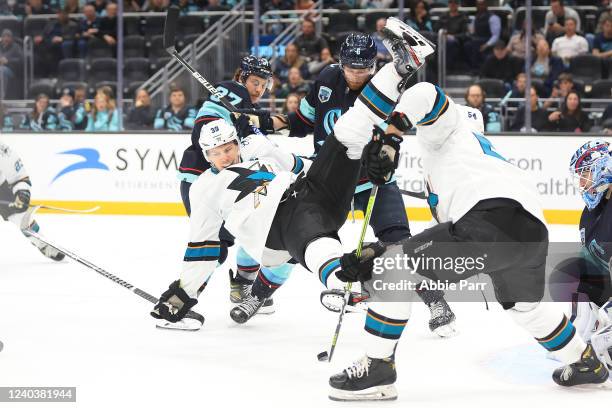 Logan Couture of the San Jose Sharks is tripped up during the second period against the Seattle Kraken at Climate Pledge Arena on April 29, 2022 in...