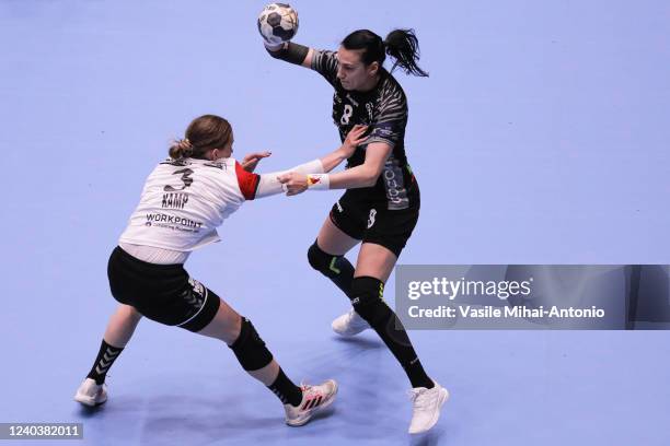 Kaja Kamp of Esbjerg challenges Cristina Neagu of CSM Bucuresti during the EHF Women´s Champions League Quarter Final First Leg match between CSM...