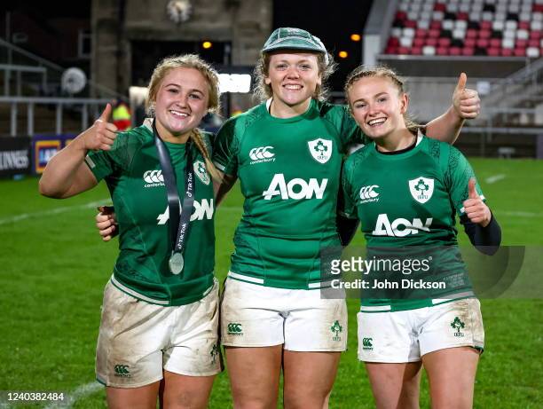 Belfast , United Kingdom - 30 April 2022; Ireland and Ulster players, from left, Neve Jones, Vicky Irwin and Kathryn Dane after their side's victory...