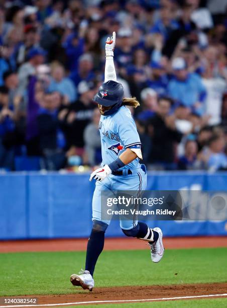 Bo Bichette of the Toronto Blue Jays celebrates after hitting a 2-run home run in the sixth inning during a MLB game against the Houston Astros at...