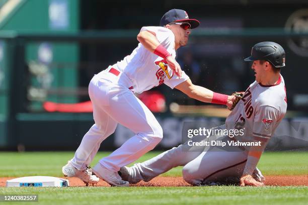 Daulton Varsho of the Arizona Diamondbacks is caught stealing second base against Tommy Edman of the St. Louis Cardinals in the first inning at Busch...