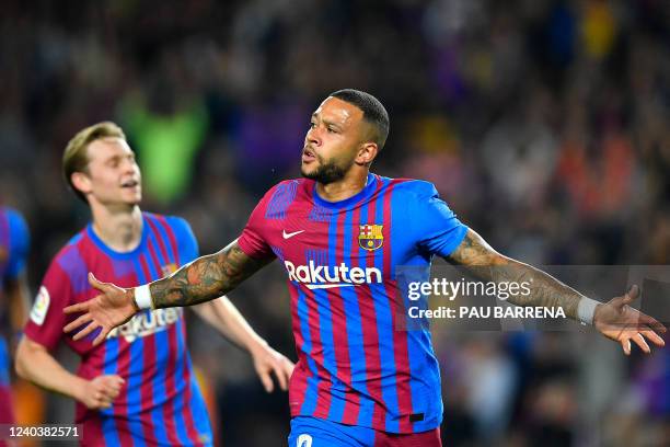 Barcelona's Dutch forward Memphis Depay celebrates scoring the opening goal during the Spanish League football match between FC Barcelona and RCD...