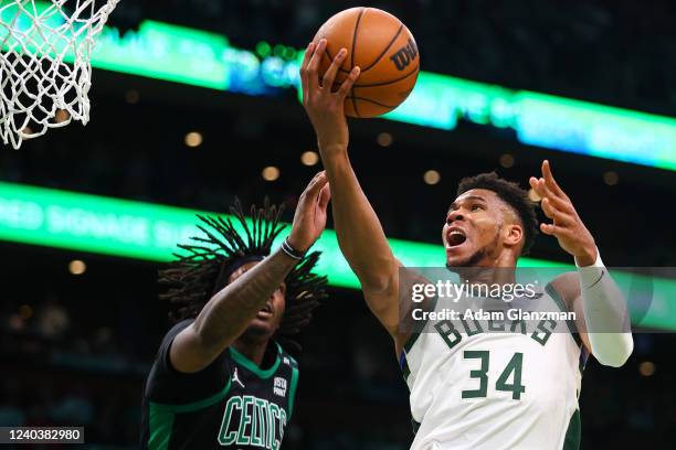 Giannis Antetokounmpo of the Milwaukee Bucks drives to the basket past Robert Williams III of the Boston Celtics during Game One of the Eastern...