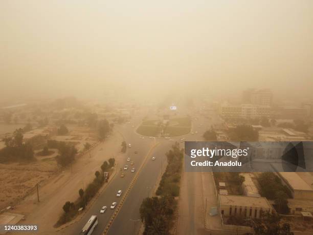 An aerial view of roads as yellow dust blankets during the sandstorm in Najaf, Iraq on May 01, 2022. Visibility degraded in traffic due to the...