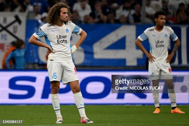 Marseille's French midfielder Matteo Guendouzi reacts after Lyon scored during the French L1 football match between Olympique Marseille and Olympique...