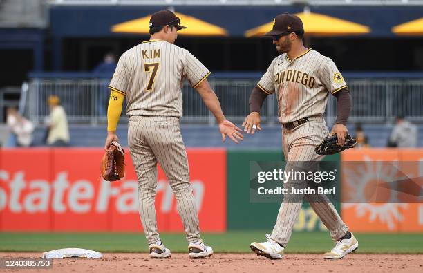 Ha-Seong Kim of the San Diego Padres celebrates with Trent Grisham after the final out in a 5-2 win over the Pittsburgh Pirates at PNC Park on May 1,...