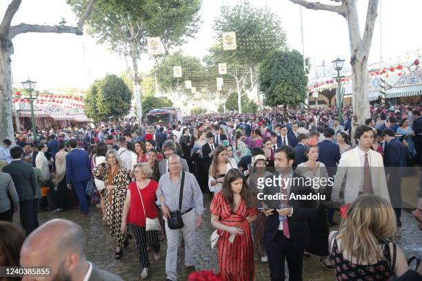 Women in colorful flamenco dresses take part in the 'Feria de Abril', the traditional Seville's Fair, with 175 years of history, on May 1, 2022 in...