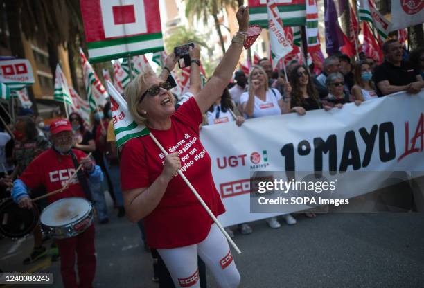 Protester is seen shouting slogans as she takes part during the Labour Day demonstration. Thousands of people called by the General Workers Union ,...