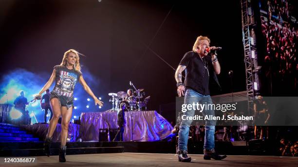 Guns n Roses lead singer Axl Rose makes a surprise appearance with Saturdays headliner Carrie Underwood to sing a pair of the groups famous songs on...