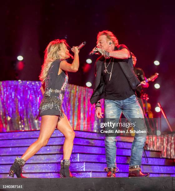 Guns n Roses lead singer Axl Rose makes a surprise appearance with Saturdays headliner Carrie Underwood to sing a pair of the groups famous songs on...