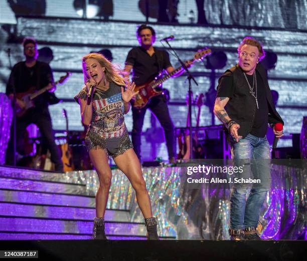 Guns n Roses lead singer Axl Rose makes a surprise appearance with Saturdays headliner Carrie Underwood to sing a pair of the groups famous songs on...