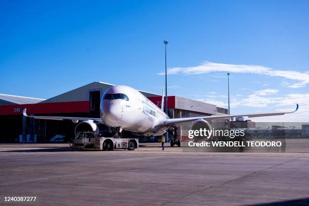 An Airbus A350-1000 aircraft is parked on the tarmac at Sydney international airport on May 2 to mark a major fleet announcement by Australian...