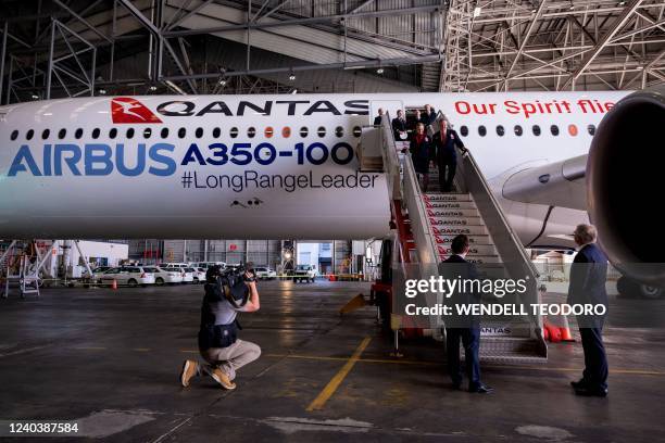 An Airbus A350-1000 aircraft is seen inside a hangar at Sydney international airport on May 2 to mark a major fleet announcement by Australian...