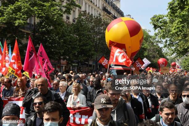 Demonstrators march with flags and banners expressing their opinion during the demonstration. Thousands of demonstrators joined the May Day March in...