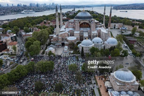 An aerial view of people gather to perform Eid al-Fitr prayer at the Hagia Sophia Grand Mosque in Istanbul, Turkiye on May 02, 2022.