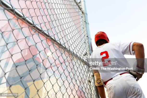 Gainesville, VA Gainesville Cardinals' pitcher Caden Merritt watches the Cardinals' 13-6 loss to the Patriot Pioneers on April 20, 2022. This was the...