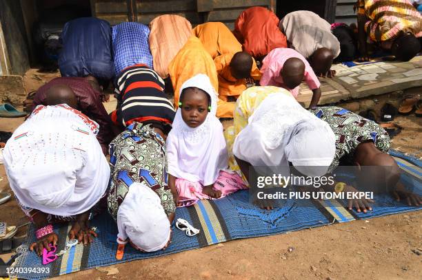 Muslims pray to celebrate Eid al-Fitr at the premises of Kara Mosque, Ibafo, Ogun State in southwest Nigeria, on May 2, 2022. - Muslims in Nigeria...