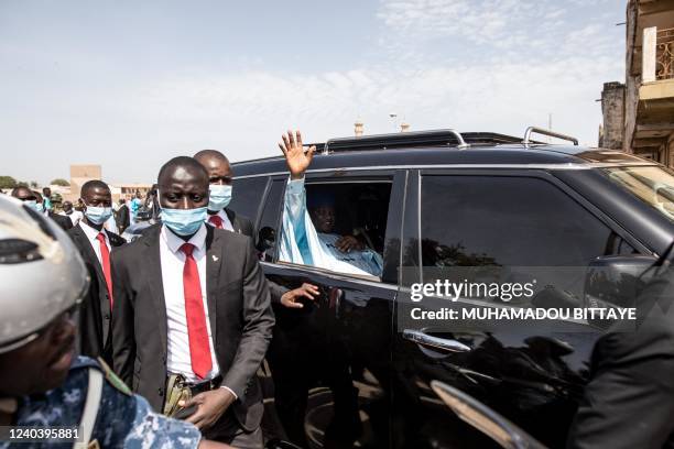 President of Gambia, Adama Barrow waves as he arrives ahead of Eid al-Fitr prayers, marking the end of the Holy month of Ramadan, at the King Fahad...