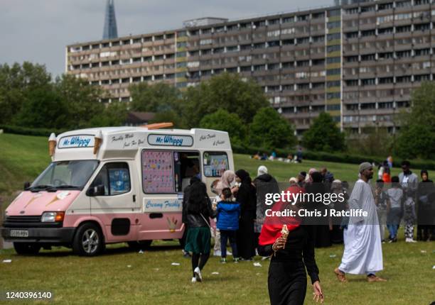 People queue for ice cream during Eid Al-Fitr celebrations at Burgess Park on May 2, 2022 in London, England. Eid al-Fitr comes at the end of...
