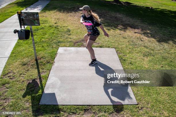 Azusa, CA, Monday, April 25, 2022 - Nicole Paulson of Covina slings her first shot on the 6th hole at the Northside Park Disc Golf Course.